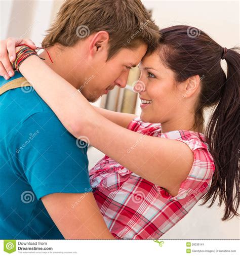Young Loving Couple Embracing And Smiling Romance Stock Image - Image of cuddle, caucasian: 26236141
