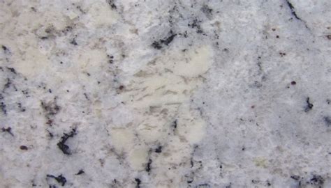 A softly polished and etched surface dappled with highlights from tiny fractures and fissures reminiscent to those found in natural granite and stone. White Ice Granite - Granite Granite Inc