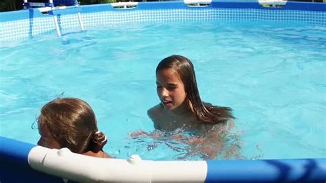 Nudism naturism, family nudism, enature. Two cute young girls swimming in a pool - Stock Video ...