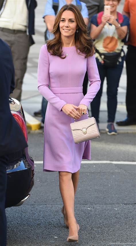 Another bold look for the duchess of cambridge. Kate recycles fan favourite purple dress for mental health ...