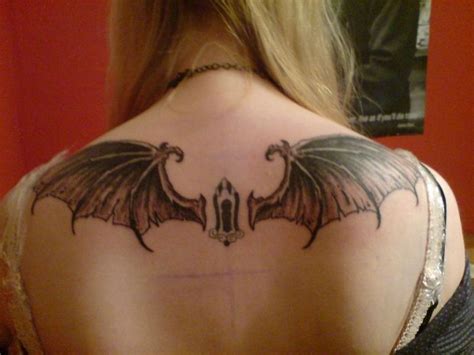 Looking for something cute yet get this tattoo on the back of your neck to truly depict the evilness. Bat Tattoo on Back for Girls