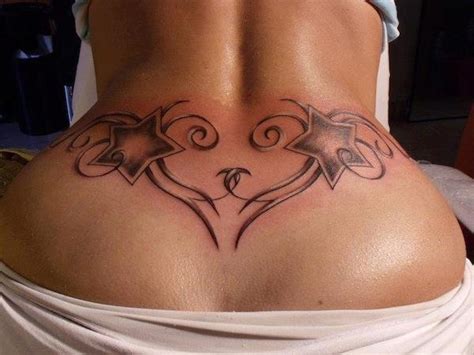 Girls pick both smaller and bigger designs, black ink or paint, as well as other designs. 24 Sexy Lower Back Tattoos -DesignBump