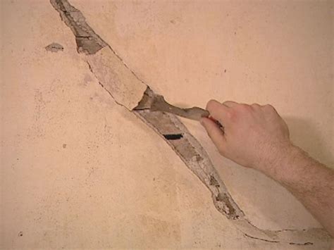 Press insect screen into wet compound; How to Restore Cracked Plaster | how-tos | DIY