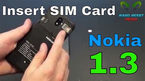 Insert the new sim card. Nokia 1.3 Insert The SIM Card - YouTube