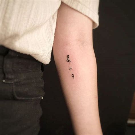 Many women dream of getting a tattoo at some point in their lives. Music Note Mini Tattoo | Small music tattoos, Music tattoos, Stylish tattoo