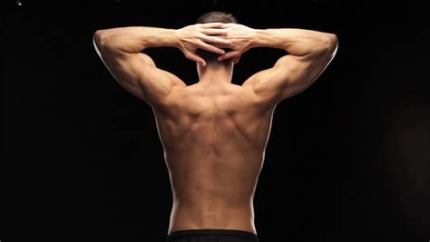 Which means if you're not in pain now, you might want to sit up and pay attention. Stock video of flexing back muscles | 3074023 | Shutterstock