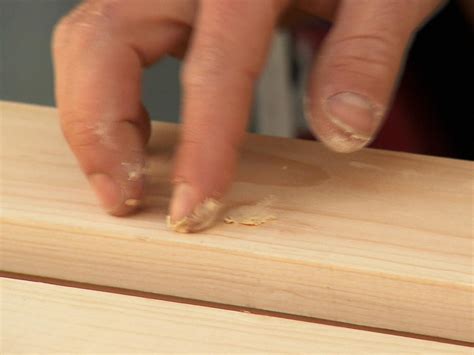 Cut the top of the wood beam using the angles you measured in the earlier steps. How to Install Faux Ceiling Beams | how-tos | DIY