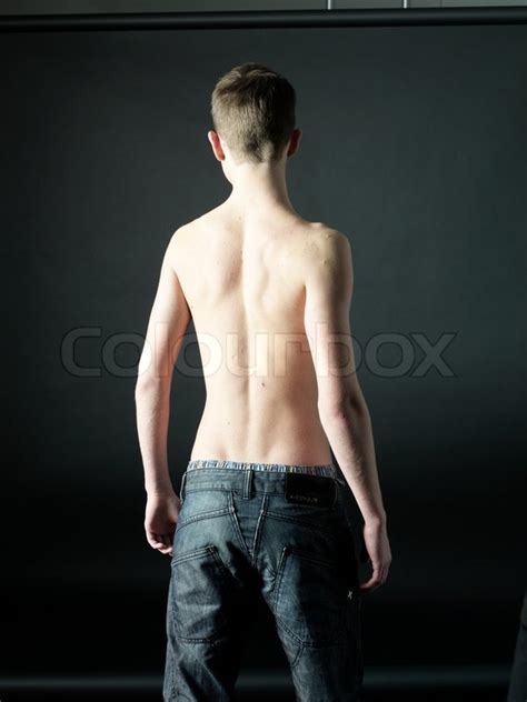 Young boys carry a slender. Young boy from the back | Stock image | Colourbox