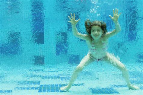 Dazzling vignettes of getting off along kyoka. Girl swimming underwater in swimming pool - Stock Photo ...