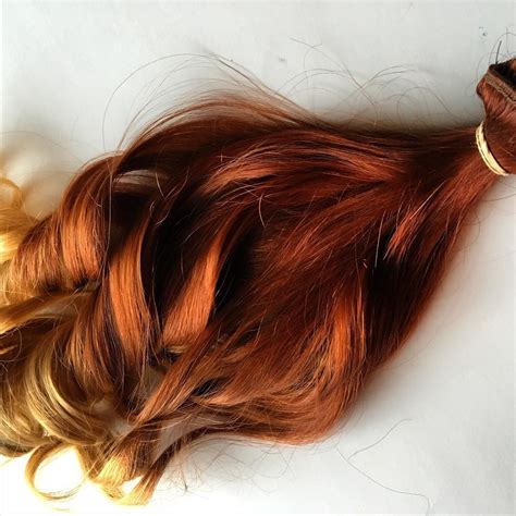 Warm blonde, which transitions into a light bleached blonde. Red and blonde ombré clip in human hair extensions # ...