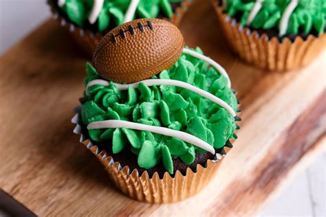 I made these cupcakes for a superbowl party we went to.turned out really cute. Easy Superbowl Football Cupcakes with Piped Grass Frosting ...