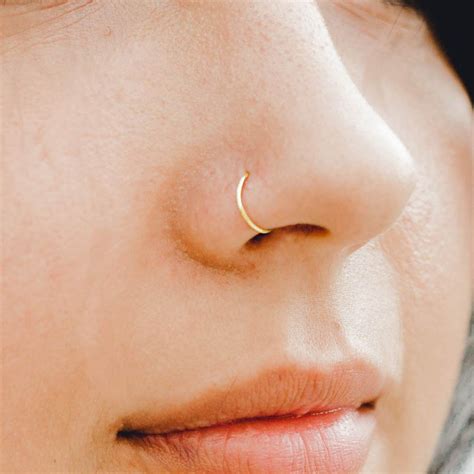 While it does somewhat resemble a nasallang piercing, the austin. Amazon.com: 22g 7mm 14k Solid Gold Snug Fitting Nose Ring ...