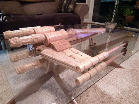 This fun starship enterprise coffee table has been hand crafted from ash, poplar and cheery wood, and it features a glass top with 1/4 inch glass, it measures 34 inches by 54 inches by 17 inches. Custom 'Star Wars' X-Wing Starfighter and 'Star Trek' U.S ...