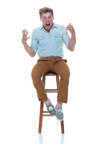 Maybe you would like to learn more about one of these? Handsome Man Sitting On A Stool Stock Photo - Download ...