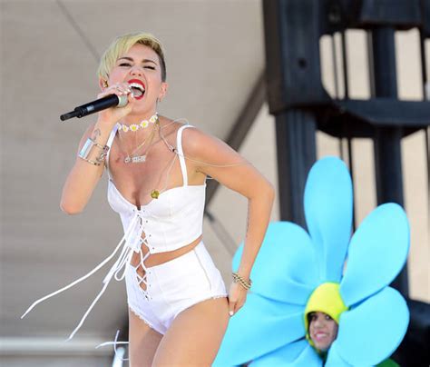 Miley cyrus was hiding behind a curtain and changing when she reached for her mic. NSFW Miley Cyrus Suffers Nip Slip During Performance