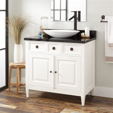 And though this bathroom appears small, the right assortment of compartments on the vanity and the placement of the sink shows that there is enough space for essentials and more. Bathroom Vanity With Vessel Sink