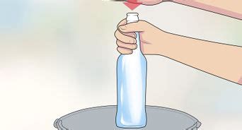 Open the beer bottle with a metal spoon. 3 Ways to Open a Beer Bottle with a Lighter - wikiHow