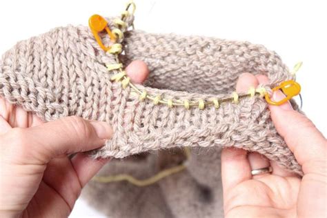 Insert the knitting needle into the corner stitch of the first row, one stitch in from the side edge. How To Pick Up Stitches for the Raglan Sleeve and Avoid ...