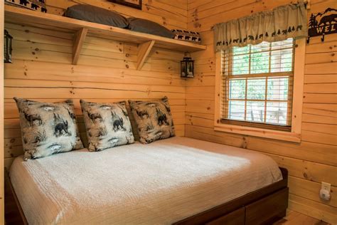 Prepare to snuggle up and get cozy because this cabin is very small & compact, yet extremely well appointed with all the comforts of home. Snuggle Bear Bungalow Log Cabin - Carefree Cabins, LLC