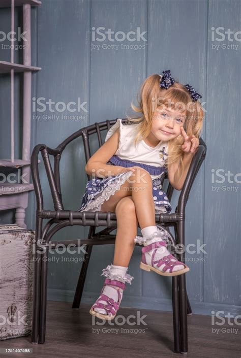 Portrait Of Little Girl In Retro Vintage Photographic Studios Stock Photo - Download Image Now 