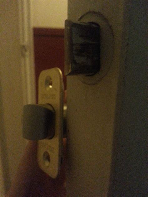 If the door latch is not extended properly before rotating the knob. doors - How to remove latch assembly that is stuck in edge ...
