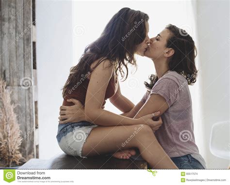 A mature blonde and her redhead friend are having a nice time together. Lesbian Couple Together Indoors Concept Stock Photo ...