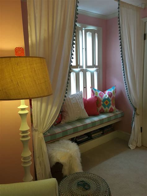 Dark reading nook surrounded with white windows fitted on the gray walls. Little girls reading nook with custom bench cushion and ...