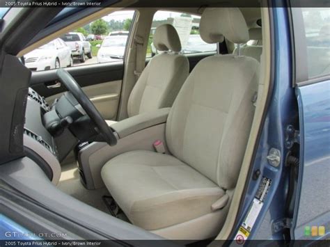 Dashboard icons are displayed in a variety of colors, depending on the system and its status in a specific vehicle. Ivory/Brown Interior Front Seat for the 2005 Toyota Prius Hybrid #82735833 | GTCarLot.com