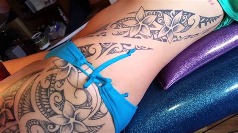 Design elements like flowers, heart shapes, stars, butterflies and other feminine touches are also used to make the tribal design more female looking. Stacy's freehand hip,rib poly tribal tattoo - YouTube