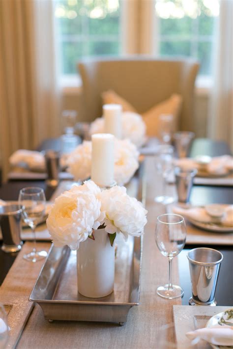 The long floral centerpiece with white candles looks spectacular and suits this long dining table. Exquisite Dining Room Table Centerpieces - For A Complete ...