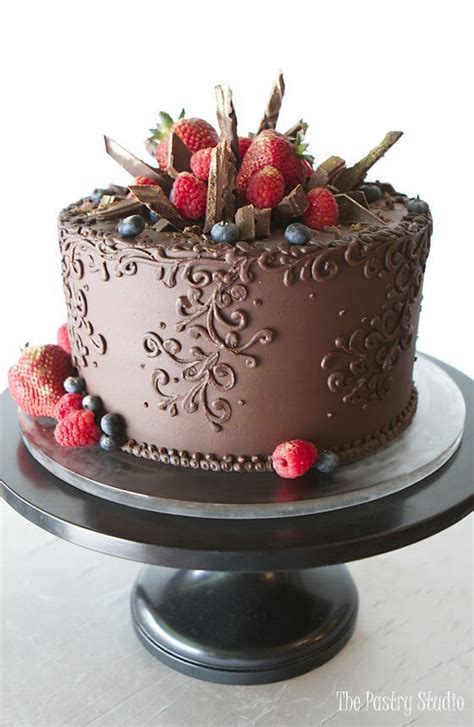 Quickly drizzle over peach slices. rich chocolate single tier cake with ornate scroll... - # ...