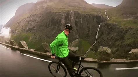 Ah, remember riding a bike? Crazy guy rides a bicycle backwards down a steep mountain