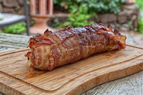 Learn how to bake pork tenderloin. Juicy pork tenderloin wrapped in bacon with apples from ...