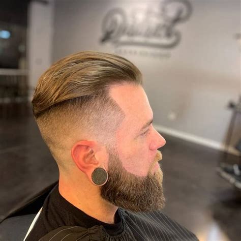 Razor line haircut the hottest hairstyle trends for black men this style mixes the precise lines and skill of a tapered fade haircut with longer curly afro hair on top shaped at an angle curls are growing up instead. 15 Refreshing Fade Haircuts for Bearded Men