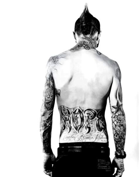 Travis is so serious about the relationship, in fact, that he got the name kourtney tattooed right above his nipple. travis barker - first love!!! | Travis barker tattoos ...