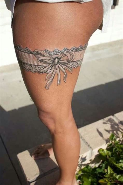 Starting up new adventures is all part of life. Beautiful white lace garter leg tattoo | Feed the ...