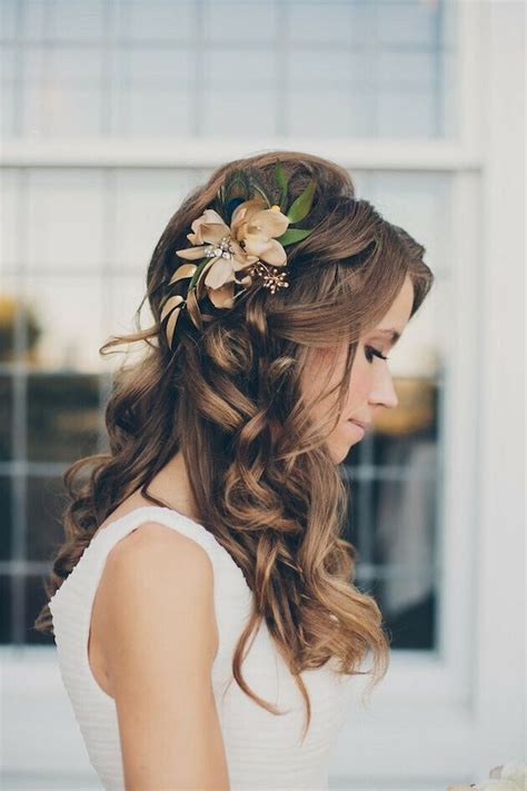 Tie back half of your hair toward on the crown of your head, then leave a couple braided tendrils. 16 Super Charming Wedding Hairstyles for 2020 - Pretty Designs