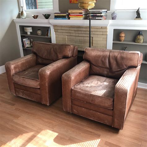 Constructed from bonded leather, this chair offers a great service life. A large striking pair of vintage leather club chairs in ...