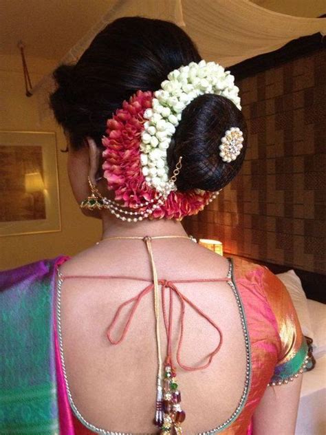 For the desi fervour, you can embellish it with flowers! 18 Indian Wedding Hairstyles with Jasmine Flowers | Bling ...