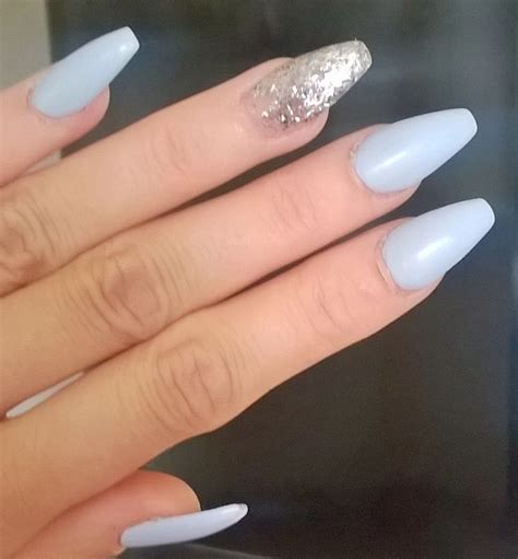 The base of the nail is light silver glitter while the tips of the nails are darker with larger glitter particles. Pin on Nails