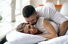 bed couple kiss hug wife morning loving man wake beautiful his young attractive people
