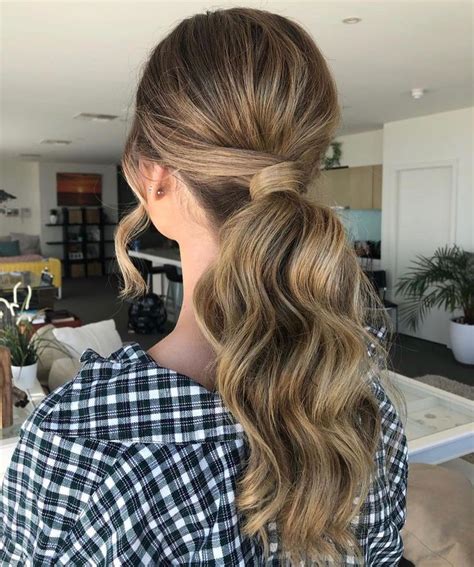 Keeping her locks poker straight with a glossy sheen, aaliyah had everyone styling their tresses in a deep side parting and smoothing their hair along their face for a faux fringe finish. 28 Incredibly Cute Ponytail Ideas for 2020: Grab Your Hair ...