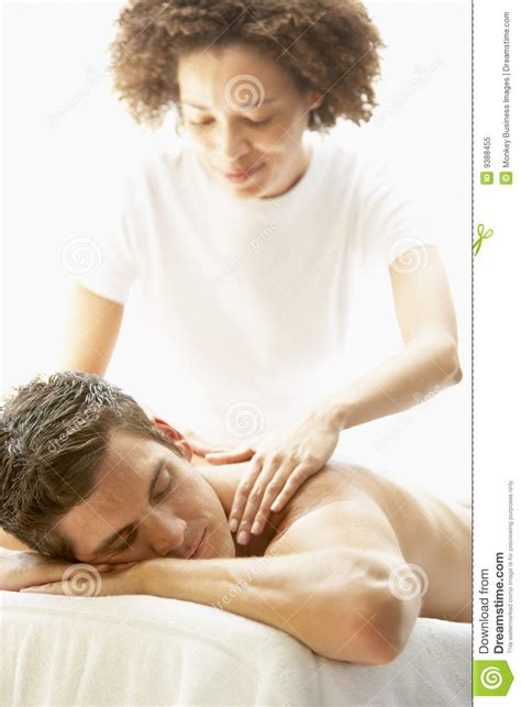He smiled gently and asked me to lie down on the massage bed. Young Man Enjoying Massage At Spa Stock Image - Image of ...