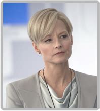 Jodie foster's blonde hair is cut in a short, layered style with long bangs swept to the side. Secretary Delacourt - Elysium Wiki Guide - IGN