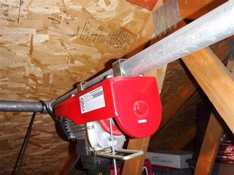 The height is adjustable and will fit any storage need. Garage Attic Electric Hoist in 2020 | Garage hoist, Garage ...