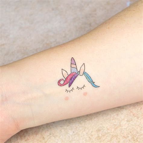 Make sure that no air bubbles get trapped inside. unicorn temporary tattoos by pink and turquoise | notonthehighstreet.com