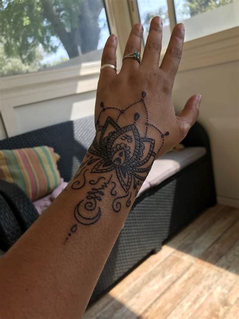 Black globe with paper airplane tattoo on right forearm. Pin by Diana J Lewis on Hand tattoo | Tribal hand tattoos ...