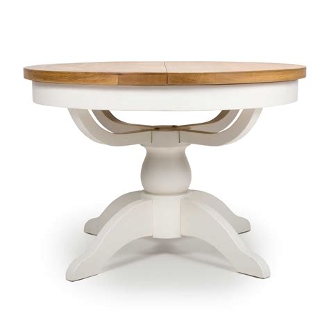 The challenge was to be able to get a table with a large extension while maintaining strength and flatness impeccable using one infinitesimal thickness. Olivia 4-6 Person Round Extending Dining Table White - Meubles