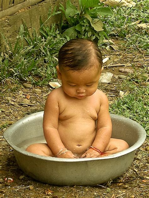 Lay a wet flannel or cloth across your baby's chest to keep them warm. EcoMum: Bathing Baby and Water Conservation - Green Prophet