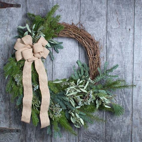 A natural spruce wreath with scented eucalyptus, dried oranges, and fresh or artificial berries. Seeded Eucalyptus & Juniper Berry Wreath from White Flower ...